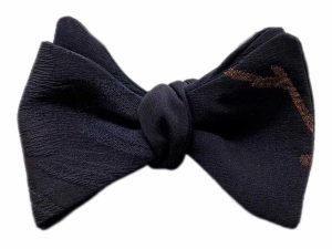 Black and gold man selftie bow tie in Japanese silk. Elegant bow tie with floral pattern. Bow tie groom ceremony
