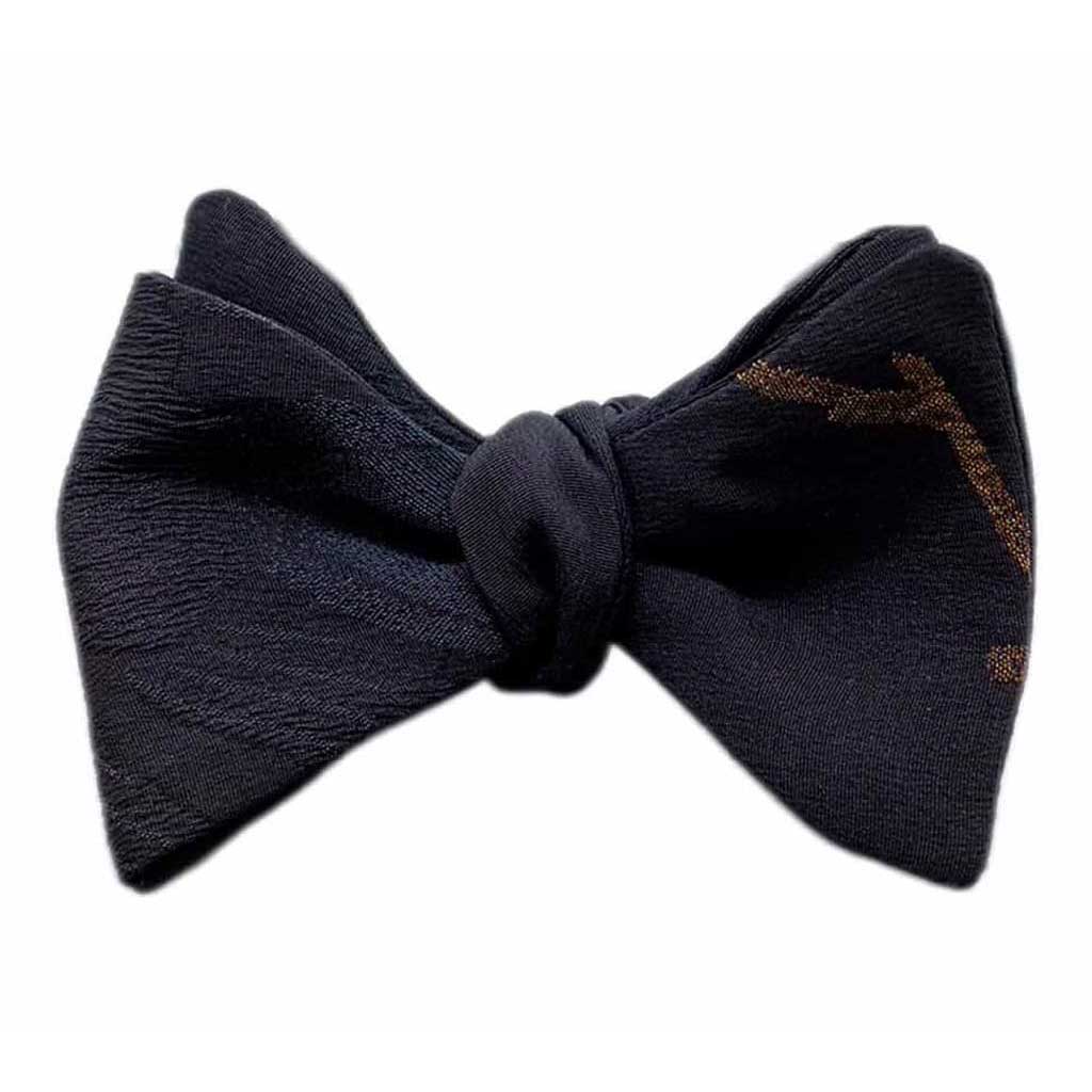 Black and gold man selftie bow tie in Japanese silk. Elegant bow tie with floral pattern. Bow tie groom ceremony