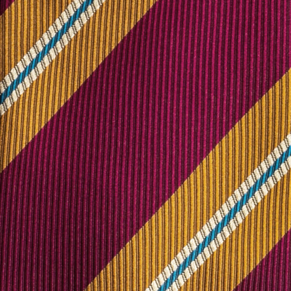 Cravatta regimental magenta arancione e blu petrolio in seta jacquard tre pieghe realizzata a mano in Italia. Cravatta a strisce 3 pieghe