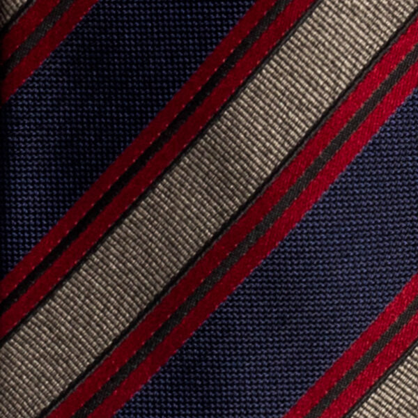 Cravatta regimental blu rosso e grigio mélange in seta jacquard tre pieghe realizzata a mano in Italia. Cravatta a strisce 3 pieghe