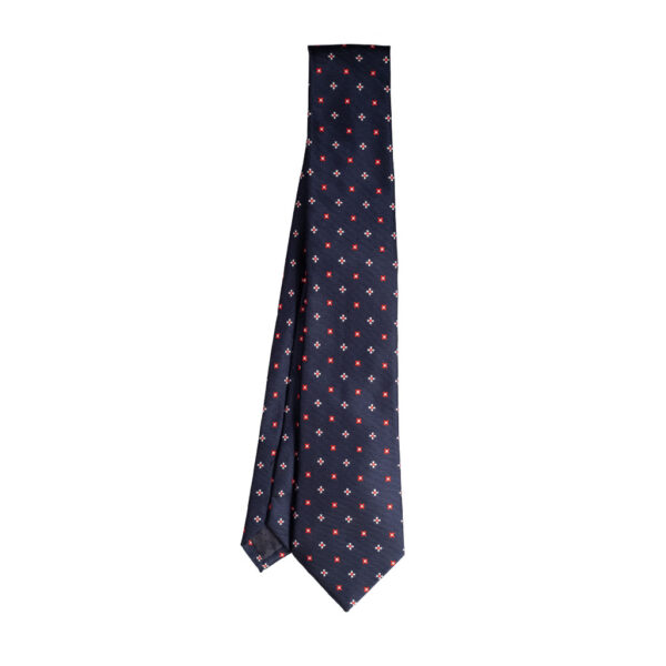 Cravatta blu micro fantasia rosso e bianco in twill di seta tre pieghe realizzata a mano in Italia. Cravatta blu micro fantasia 3 pieghe rosso