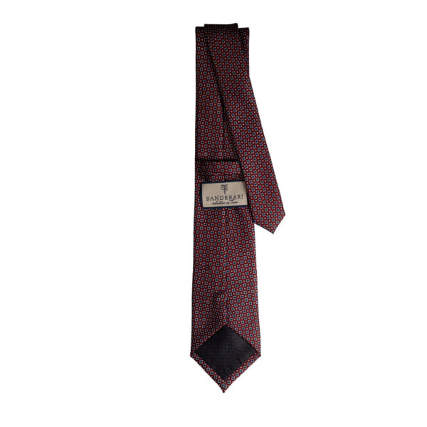 Cravatta rosso micro fantasia azzurro e bianco in twill di seta tre pieghe realizzata a mano in Italia. Cravatta rosso bordeaux micro fantasia 3 pieghe