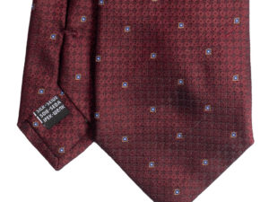 Cravatta rosso micro fantasia azzurro oro e bianco in seta jacquard tre pieghe realizzata a mano in Italia. Cravatta rosso micro fantasia 3 pieghe azzurro