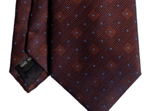 Cravatta arancione micro pois azzurro in jacquard di seta tre pieghe realizzata a mano in Italia. Cravatta arancione fantasia micro pois 3 pieghe azzurro