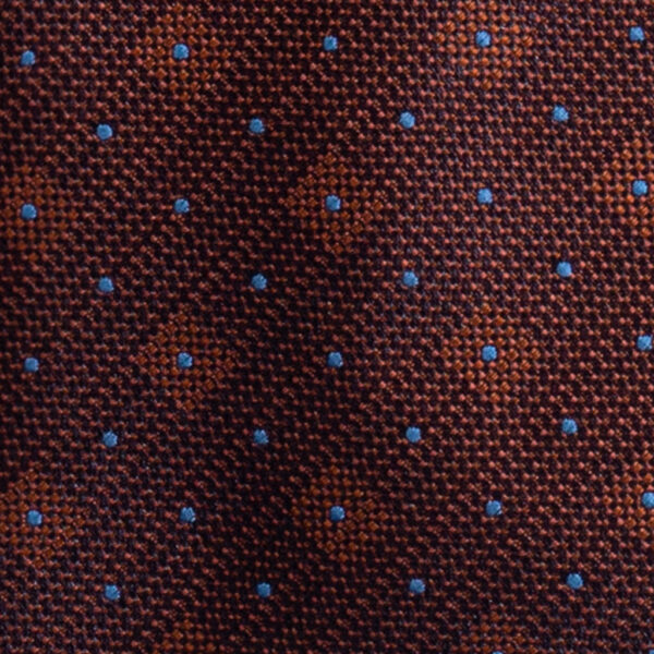 Cravatta arancione micro pois azzurro in jacquard di seta tre pieghe realizzata a mano in Italia. Cravatta arancione fantasia micro pois 3 pieghe azzurro