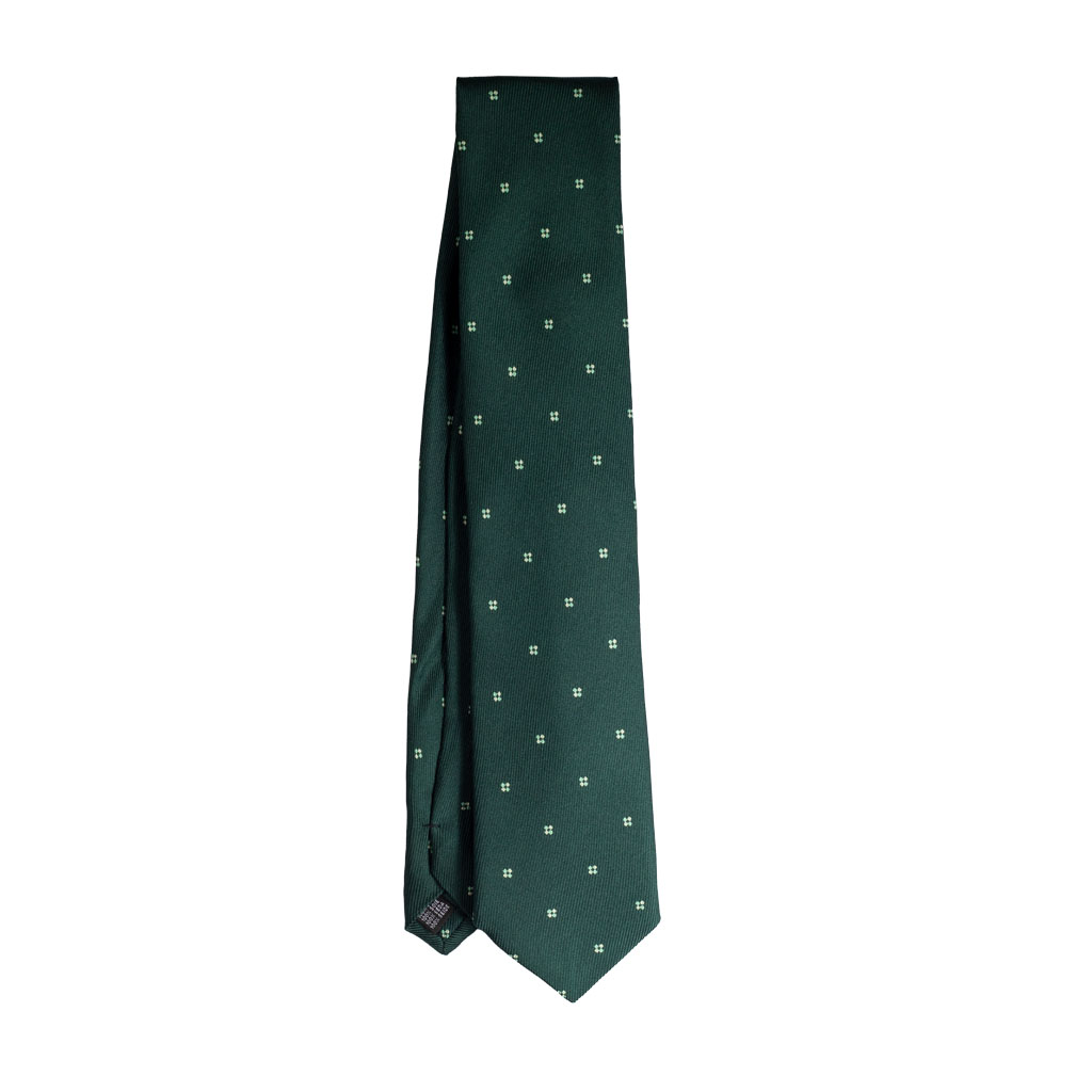 Cravatta verde micro fantasia bianco in seta jacquard sette pieghe realizzata a mano in Italia. Cravatta micro fantasia sette pieghe di alta qualità