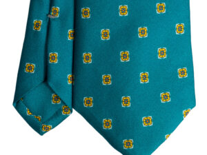 Cravatta verde micro fantasia giallo arancione e bianco sette pieghe in twill di seta realizzata a mano in Italia. Cravatta micro fantasia sette pieghe