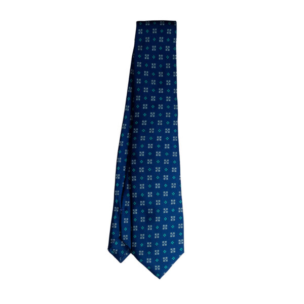 Cravatta blu micro fantasia azzurro e celeste sette pieghe in twill di seta realizzata a mano in Italia. Cravatta micro fantasia sette pieghe